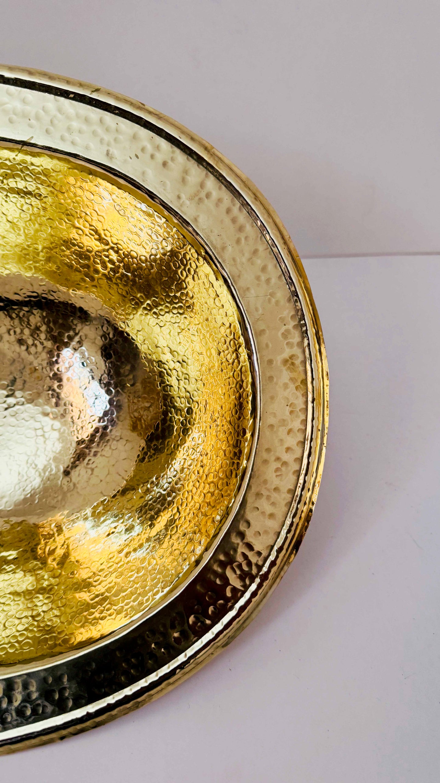 a close up of a metal bowl on a table