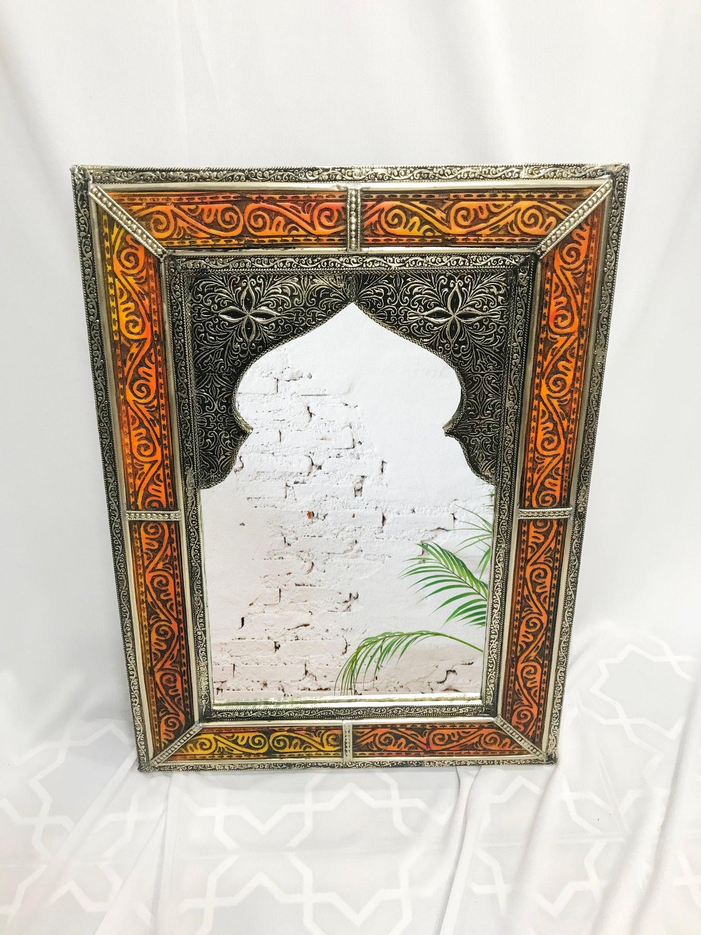 a mirror with a picture of a building on it