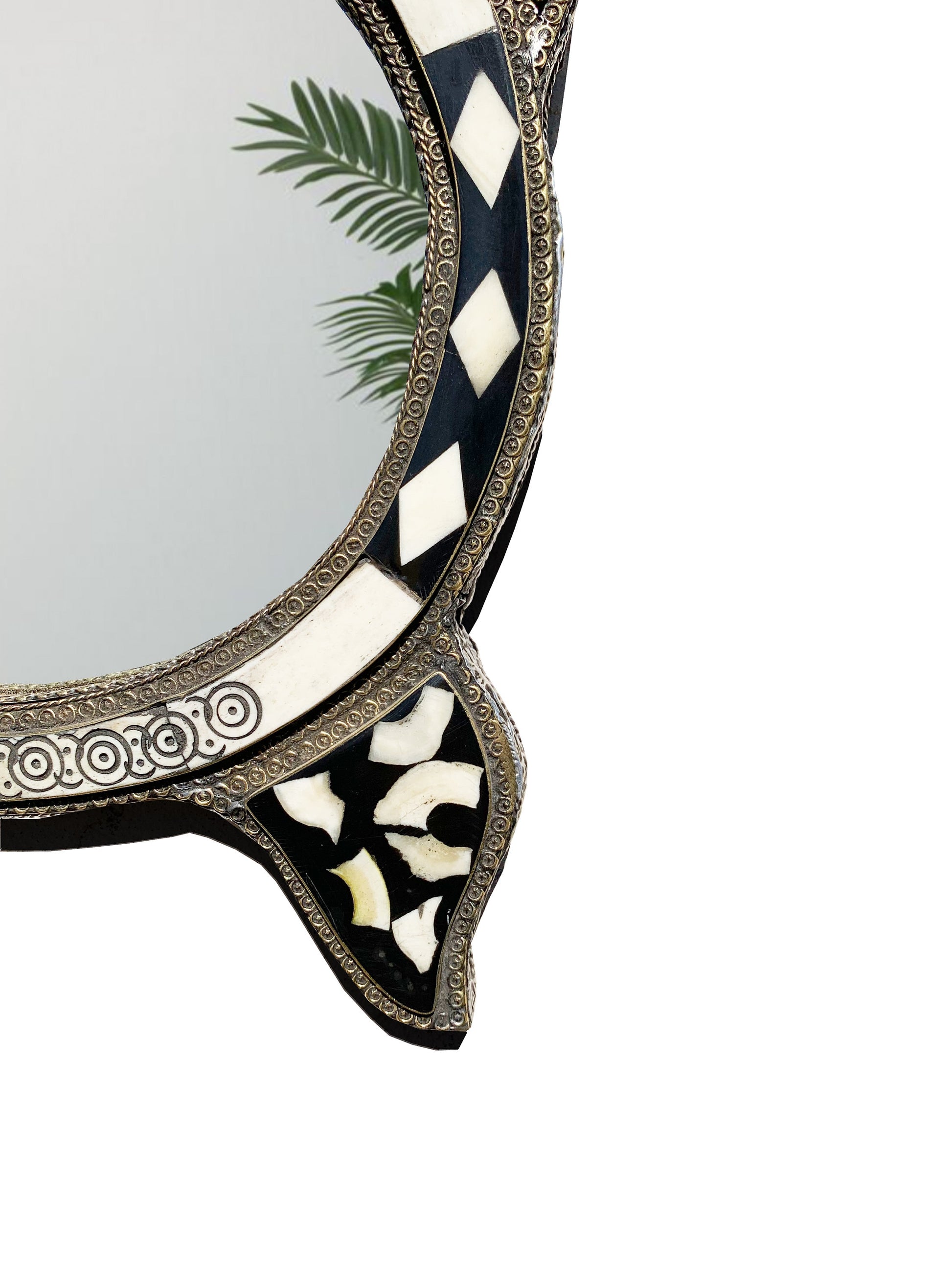 a black and white mirror with a palm tree on it