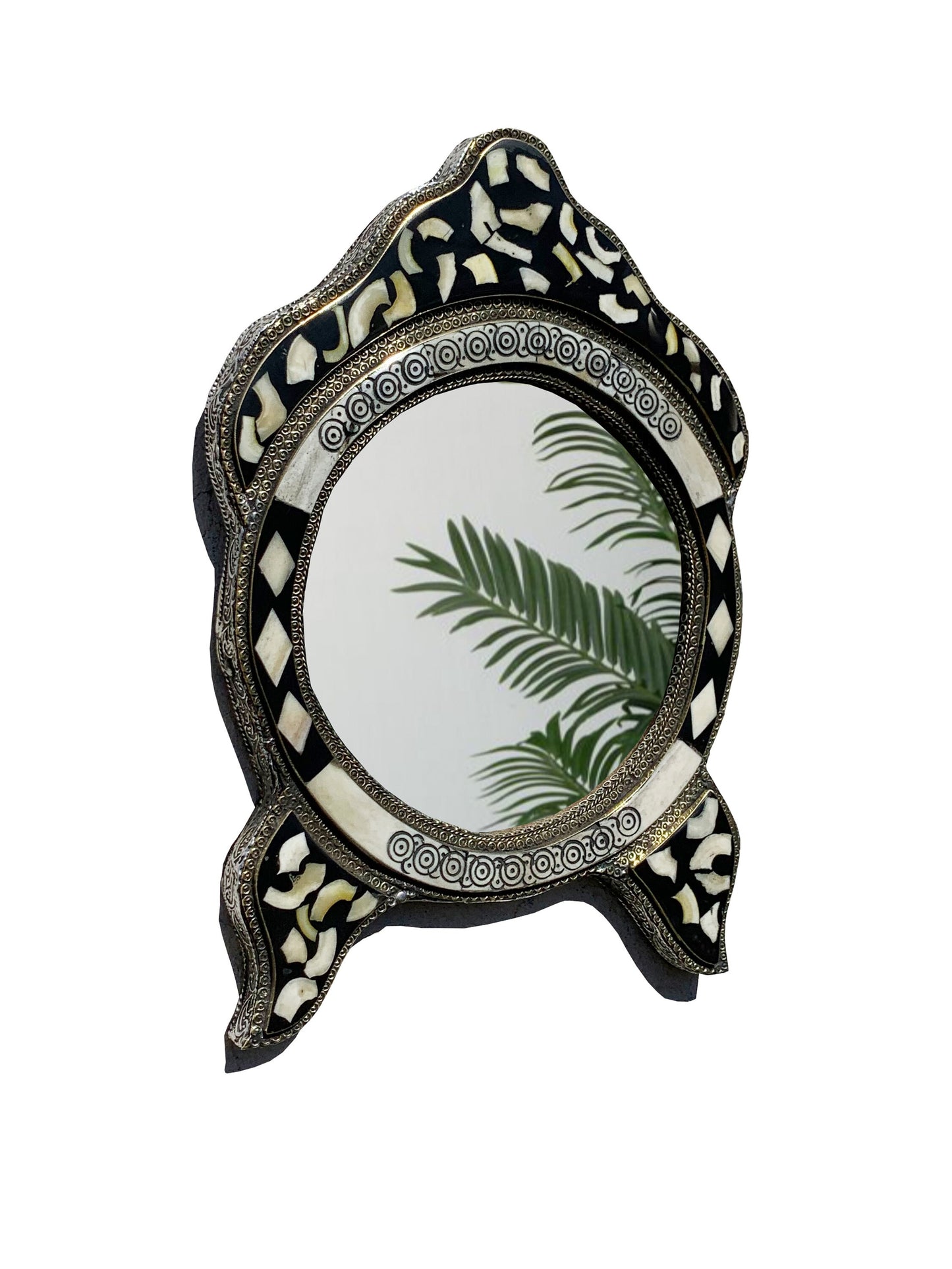 a mirror with a palm leaf on it