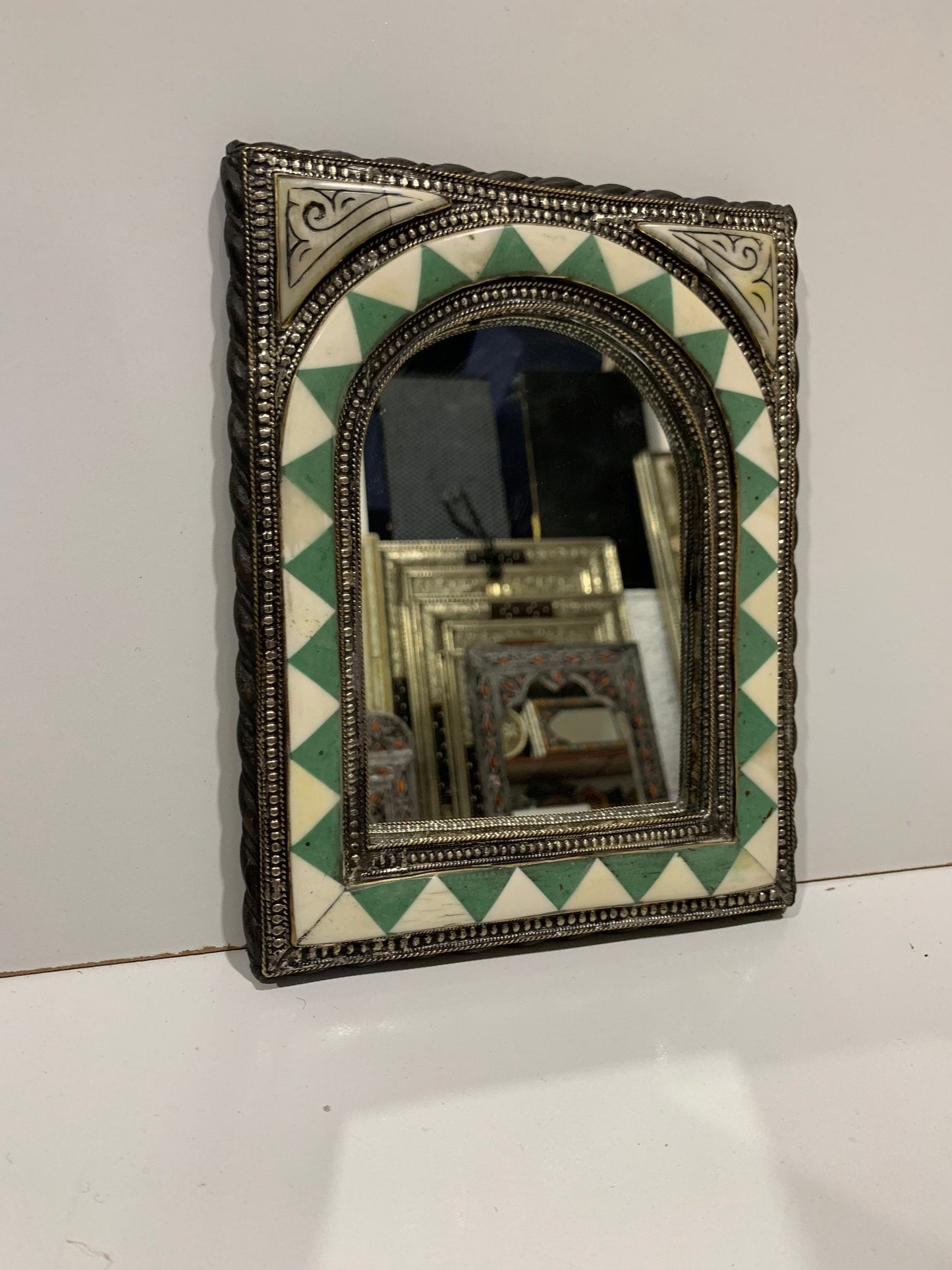 a mirror that is sitting on a wall