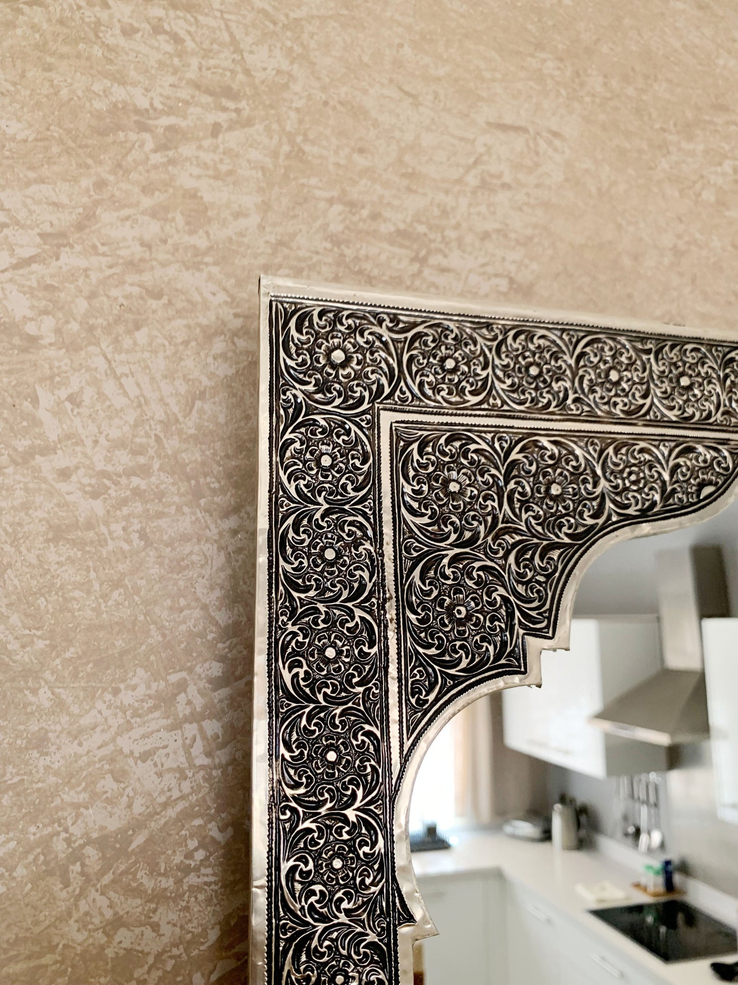 a mirror that is on a wall in a room