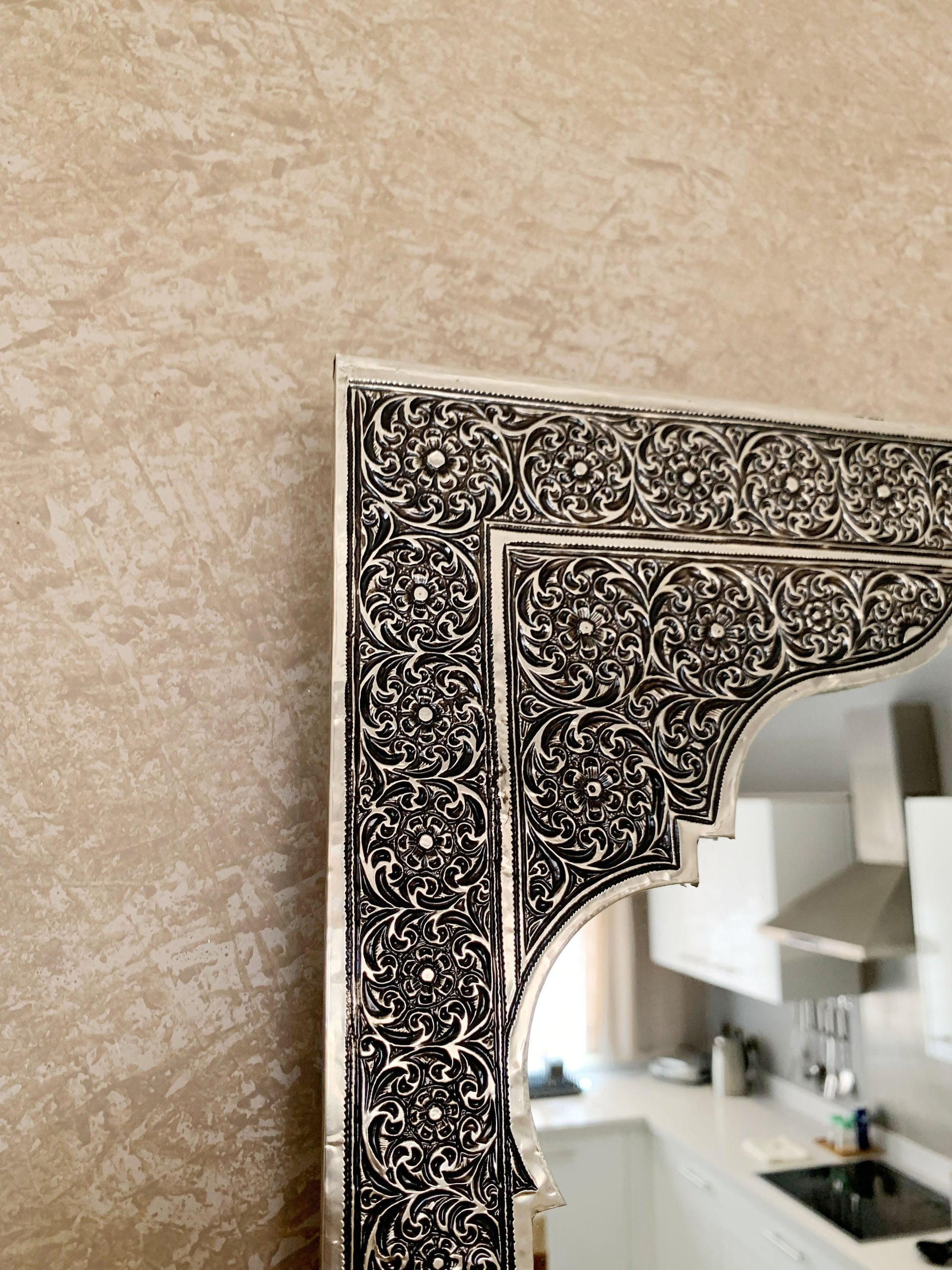 a mirror that is on a wall in a room