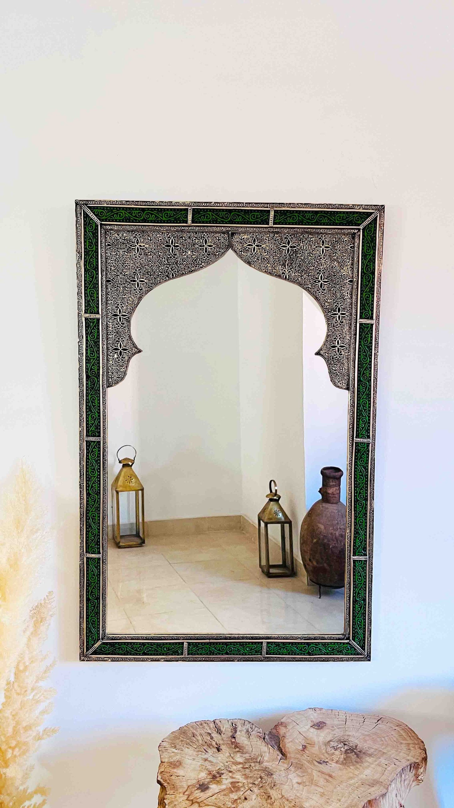 a mirror sitting on top of a wooden table