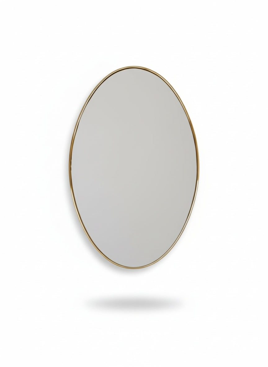 Round mirror with a gold frame on a white background
