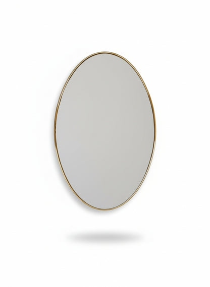 Round mirror with a gold frame on a white background