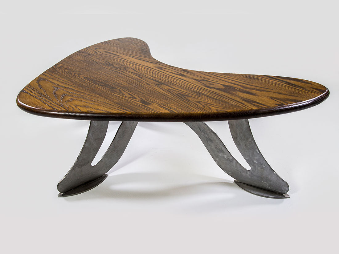 Wooden coffee table with metal base on a white background