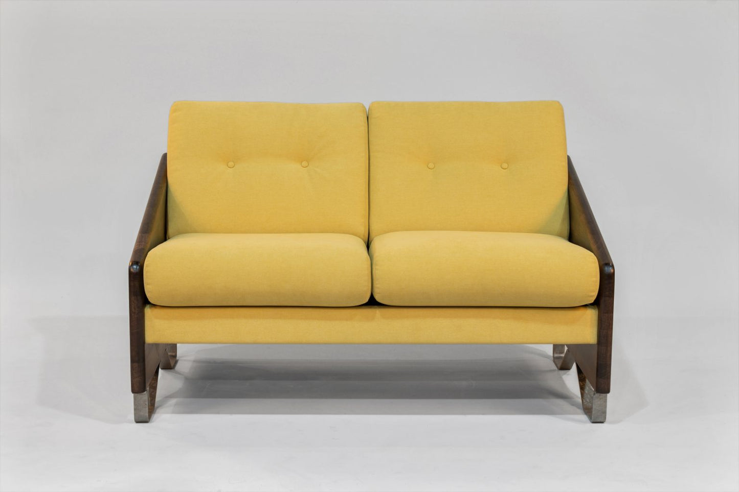 Yellow two-seater sofa with dark wooden frame on a white background