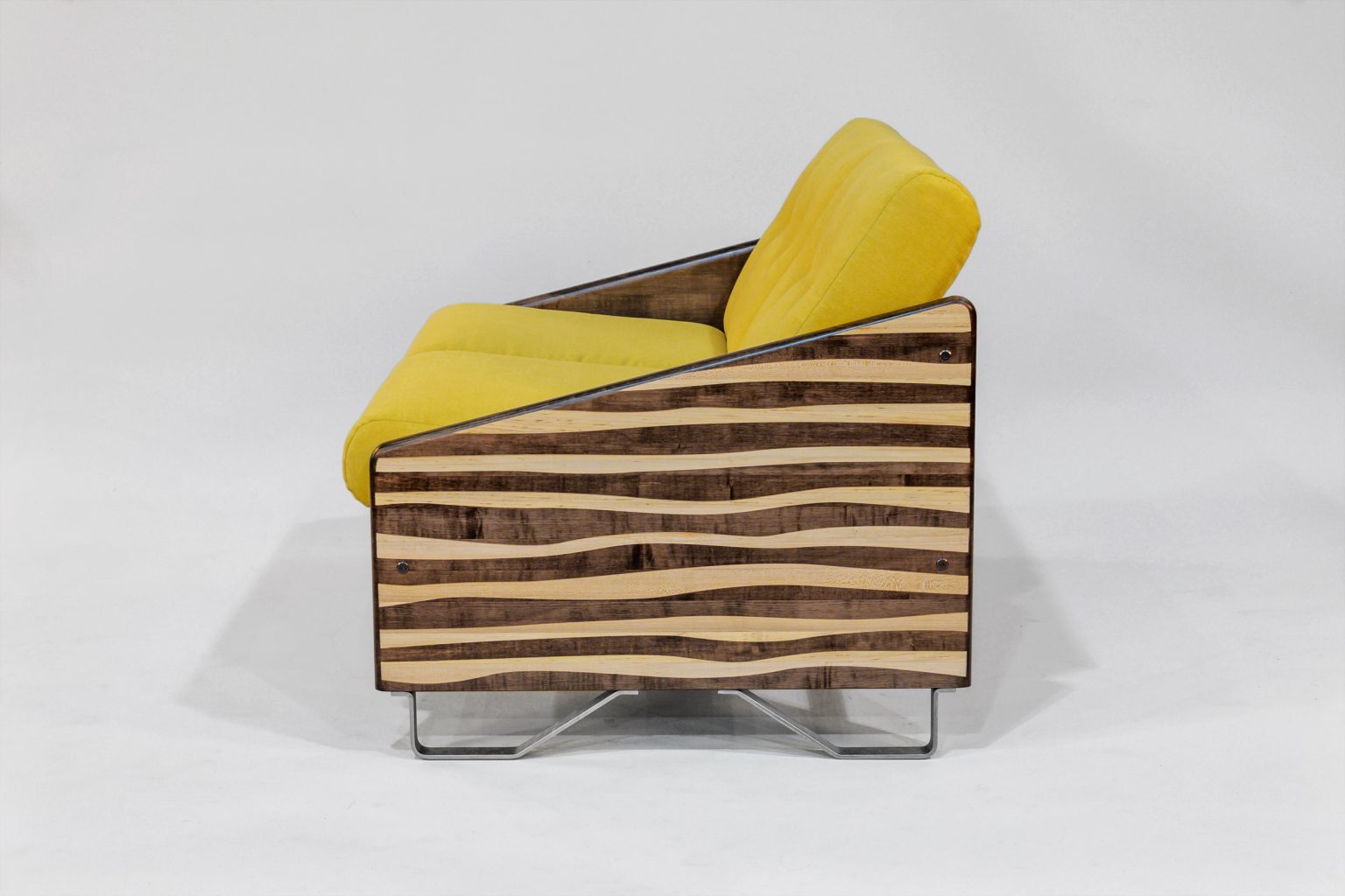 Modern chair with yellow cushion and wooden striped backrest on a white background