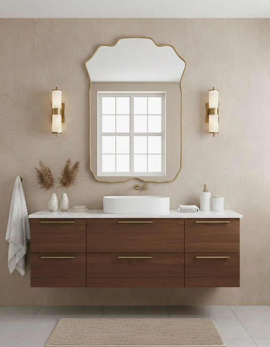 Soft crest rectangle brass mirror styled above modern bathroom vanity