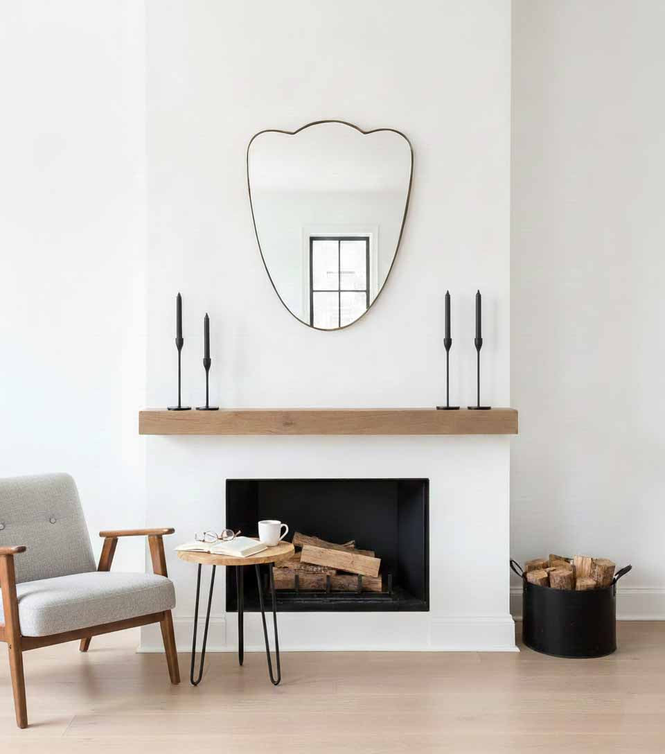 Soft Crest modern brass mirror above fireplace