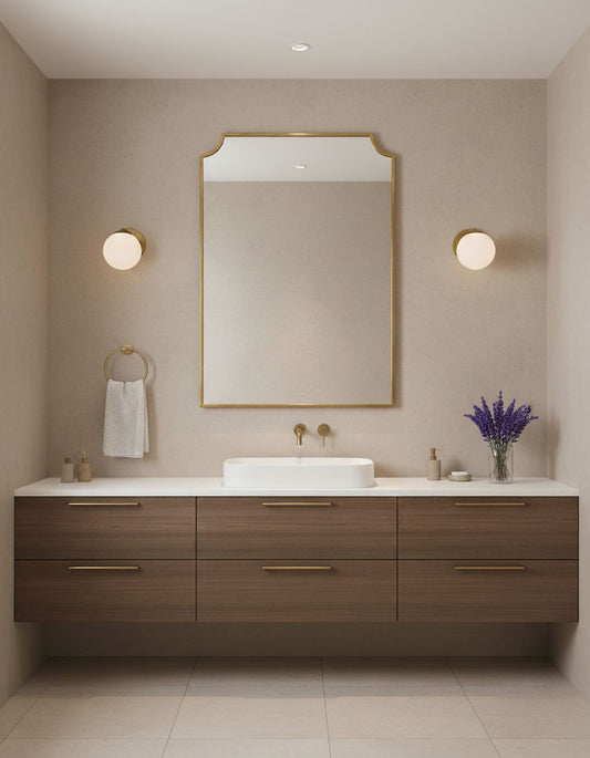 Modern chateau rectangle brass mirror above double sink bathroom vanity