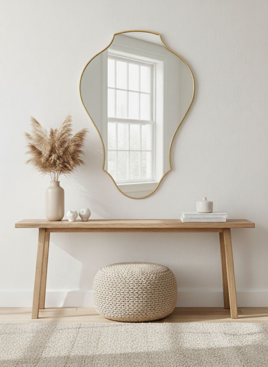 Tulip shield brass mirror styled above wooden console table
