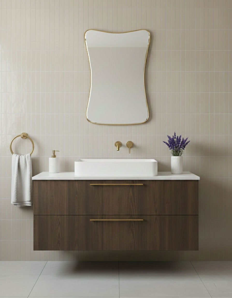 Cloud Curve Rectangle brass mirror above modern bathroom vanity with soft curved rectangular shape
