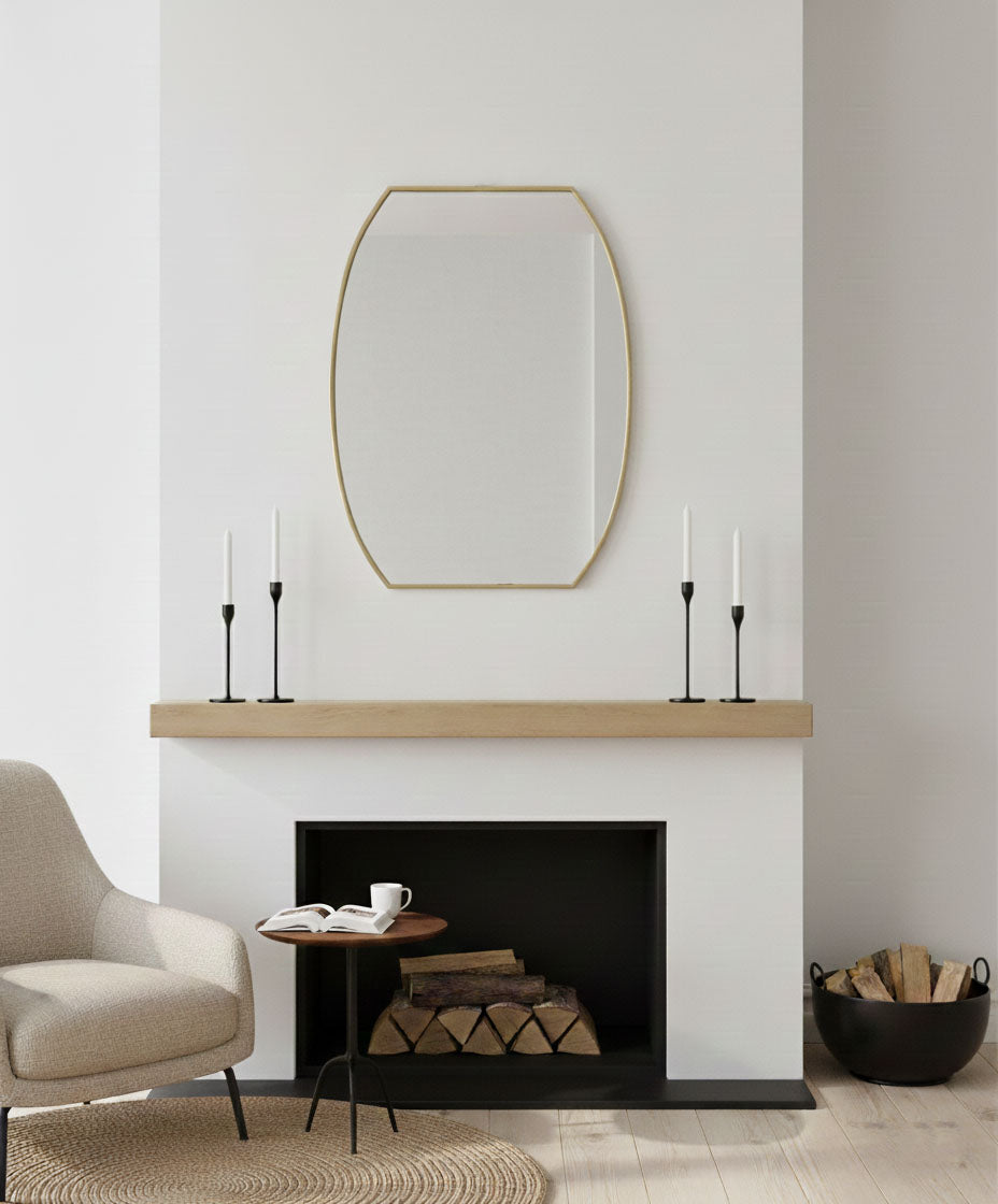 Luxe Contour Rectangle brass mirror styled above a modern fireplace mantel