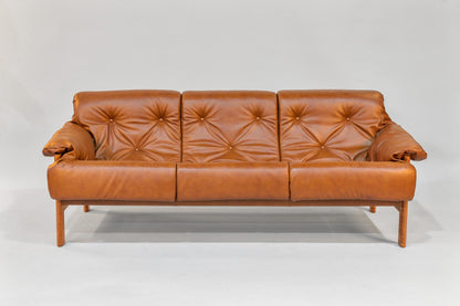 Brown leather sofa on a white background