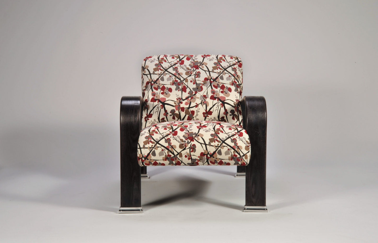 Chair with floral-patterned cushion on a gray background
