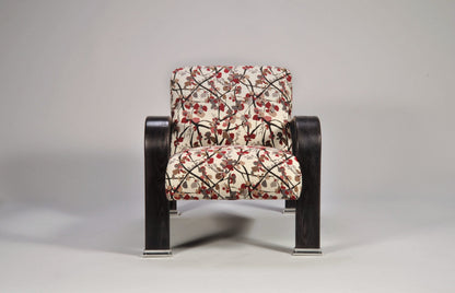 Chair with floral-patterned cushion on a gray background