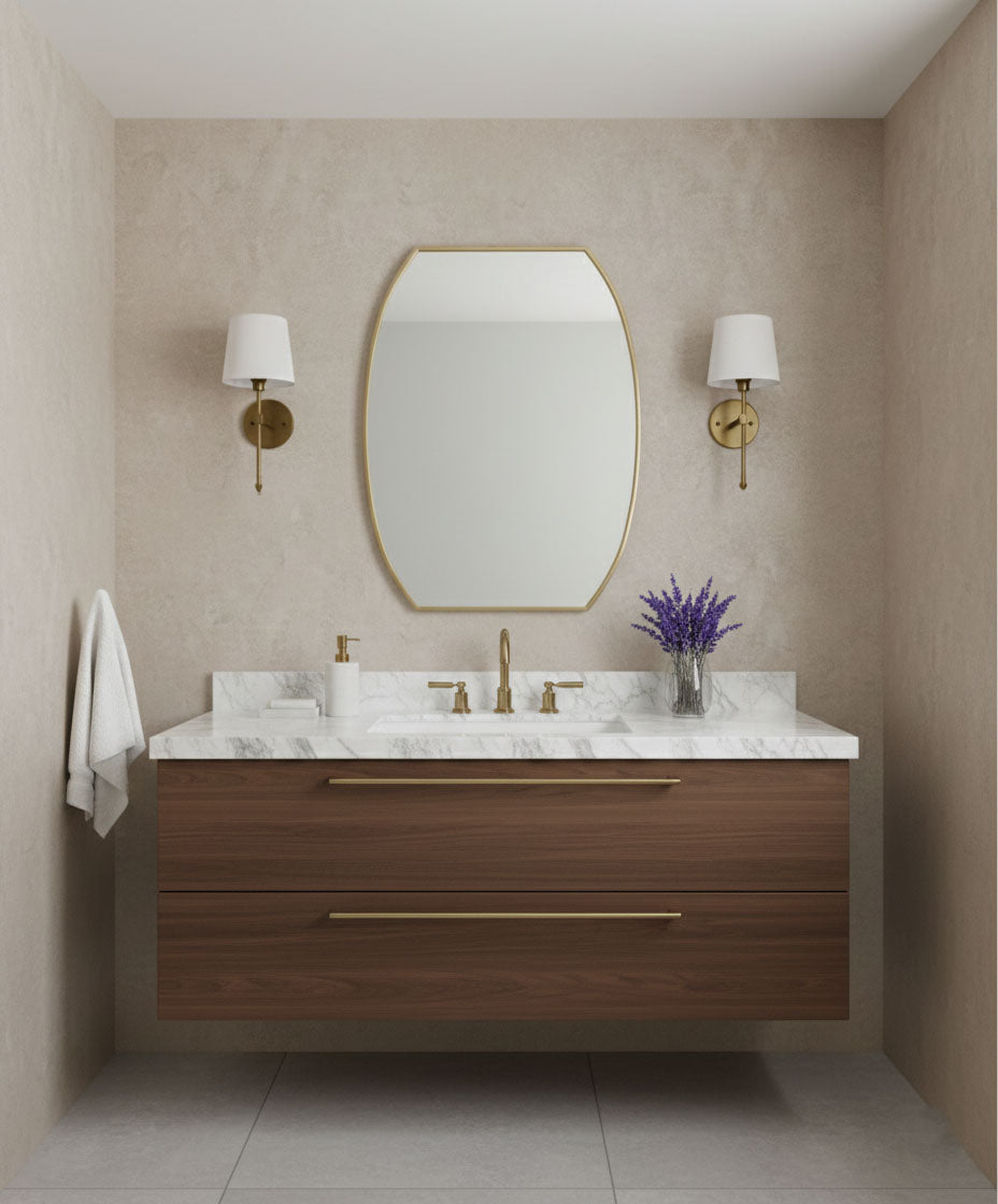 Contoured rectangle brass mirror in a minimalist double sink bathroom