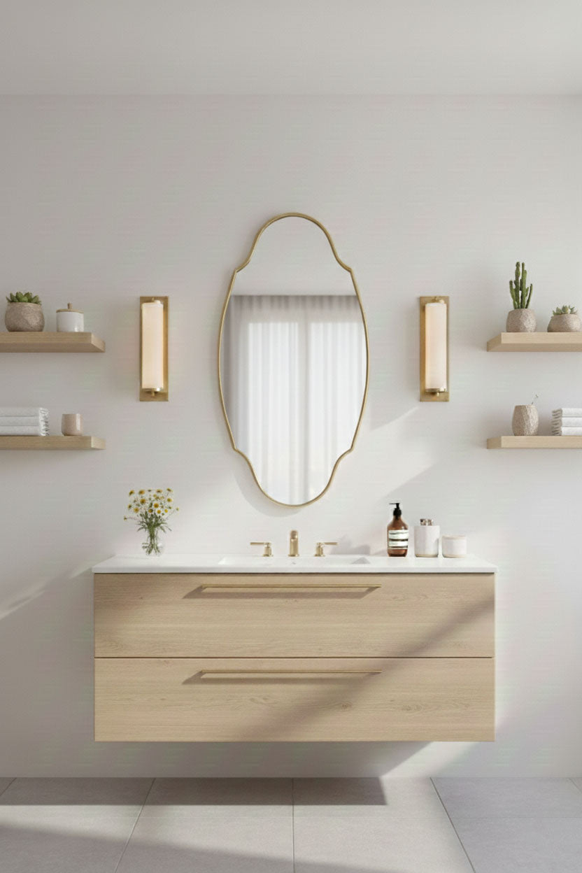 Regal oval brass mirror above modern bathroom vanity