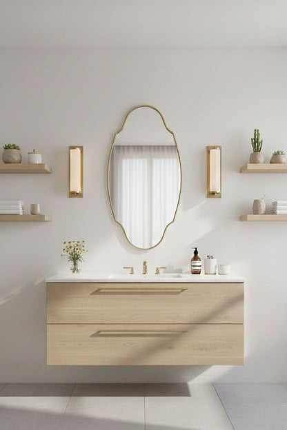 Regal oval brass mirror above modern bathroom vanity