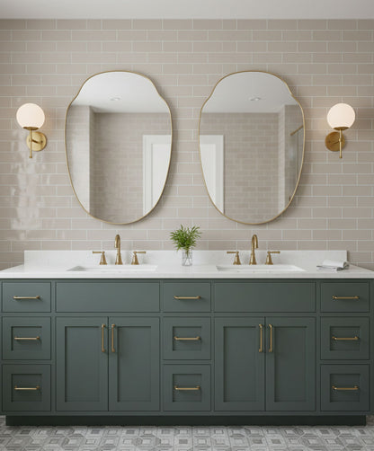 Pair of Pebble Crest brass mirrors over double bathroom vanity