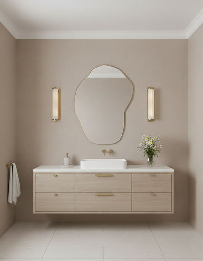 Handmade Drift Pebble brass mirror styled in neutral bathroom