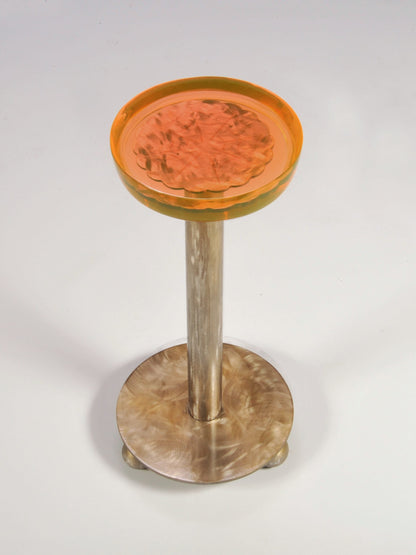 Decorative stool with a wooden base and orange top on a white background