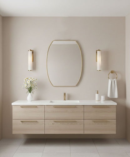 Luxe Contour Rectangle brass mirror over a floating bathroom vanity