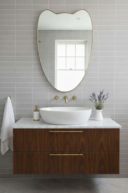 Handmade Double-Petal Crest brass mirror over bathroom sink