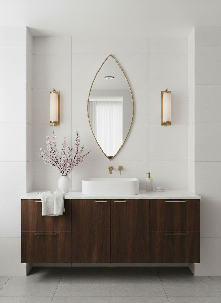 Organic leaf silhouette mirror over a dark wood bathroom vanity