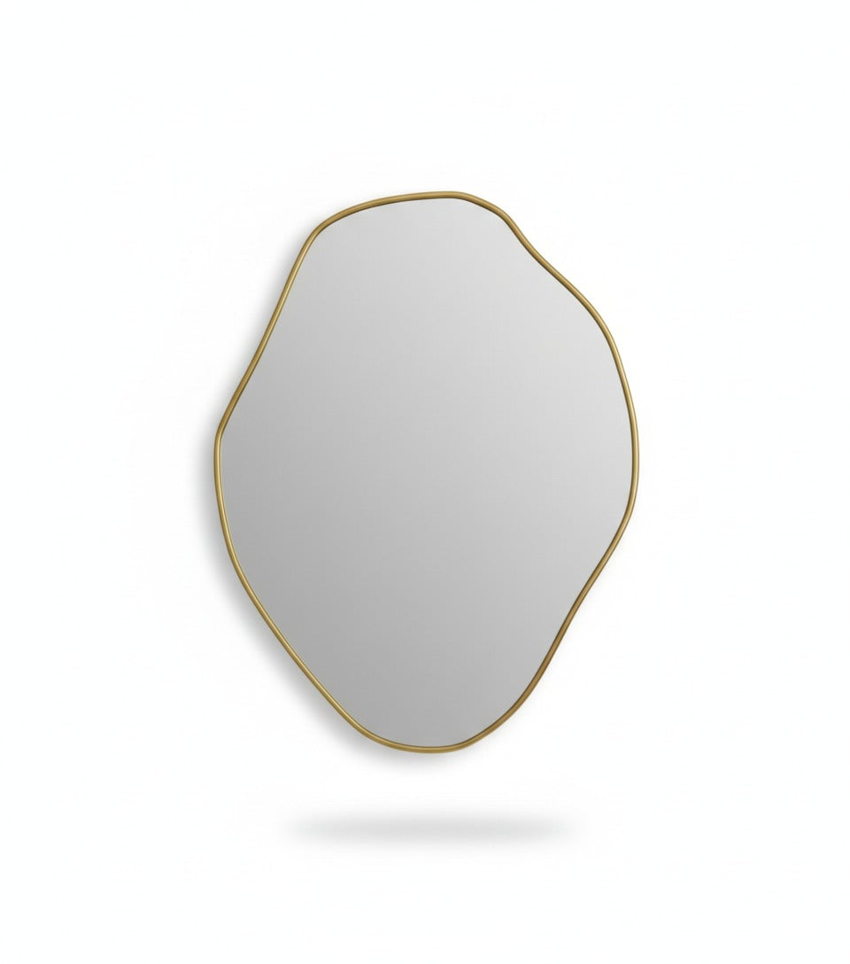 Handmade freeform brass wall mirror isolated on white background