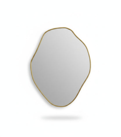 Handmade freeform brass wall mirror isolated on white background