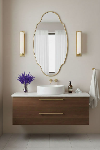 Modern oval brass vanity mirror with wall sconces