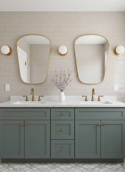 Pair of organic brass mirrors over double bathroom vanity