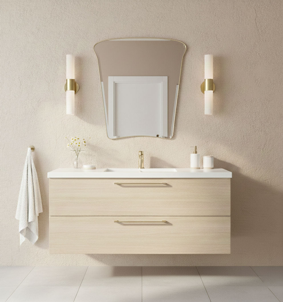 Tulip Crest brass vanity mirror with soft curves in minimalist bathroom