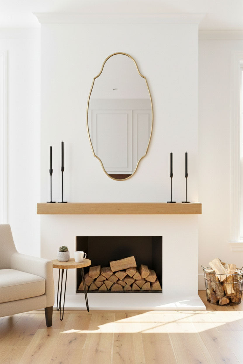 Regal oval brass mirror above fireplace mantel
