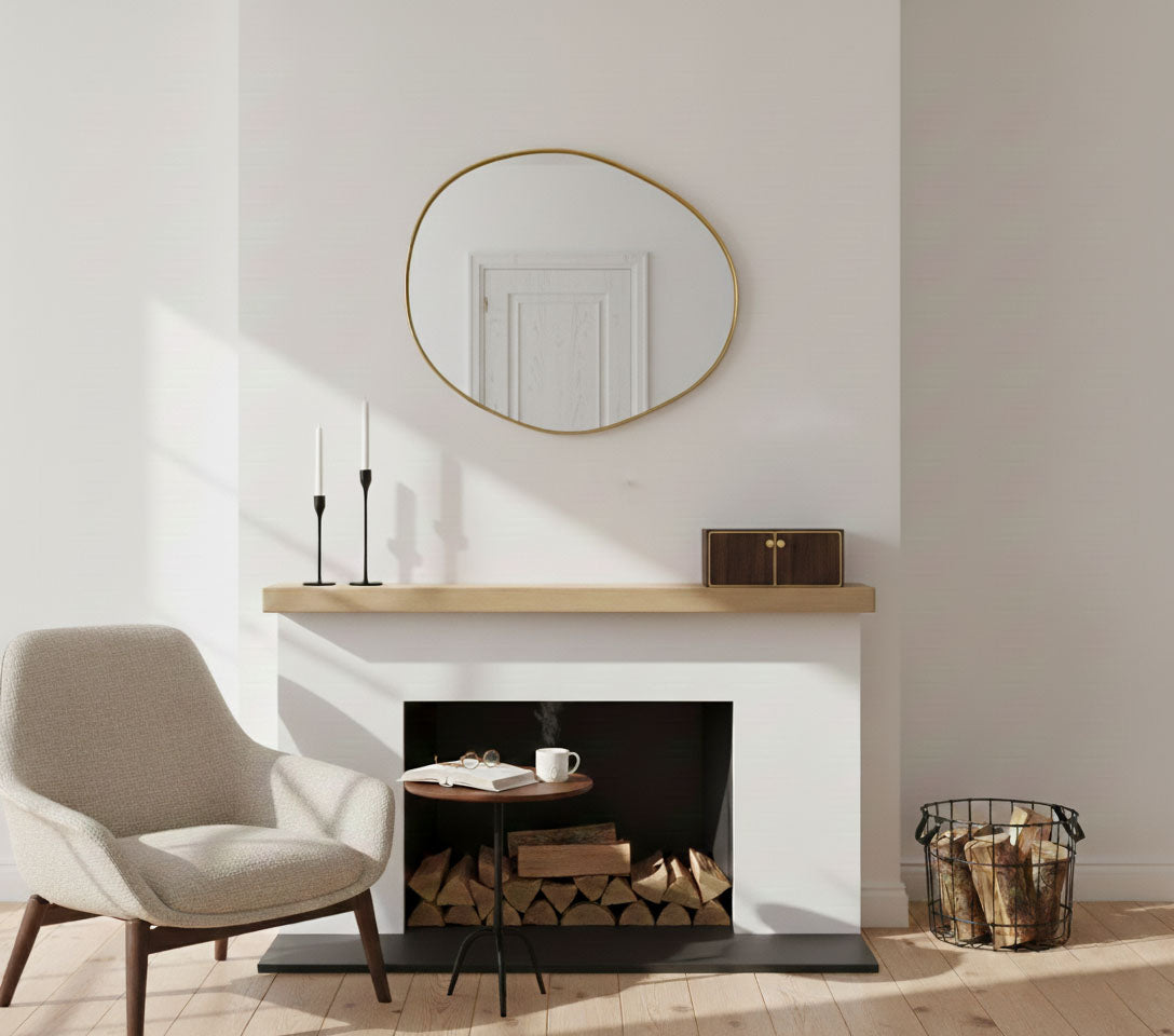Raw edge brass mirror styled above a fireplace mantel