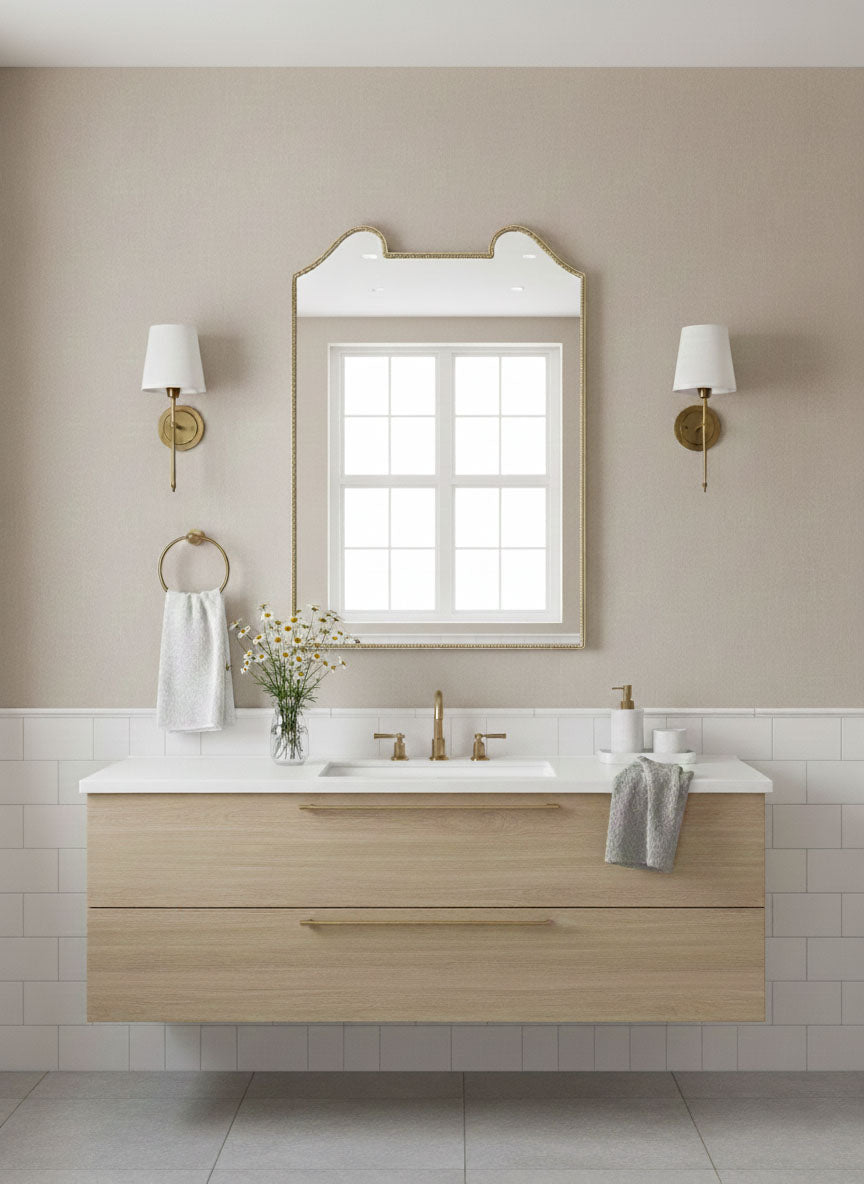 Double arch crest mirror styled in neutral bathroom interior