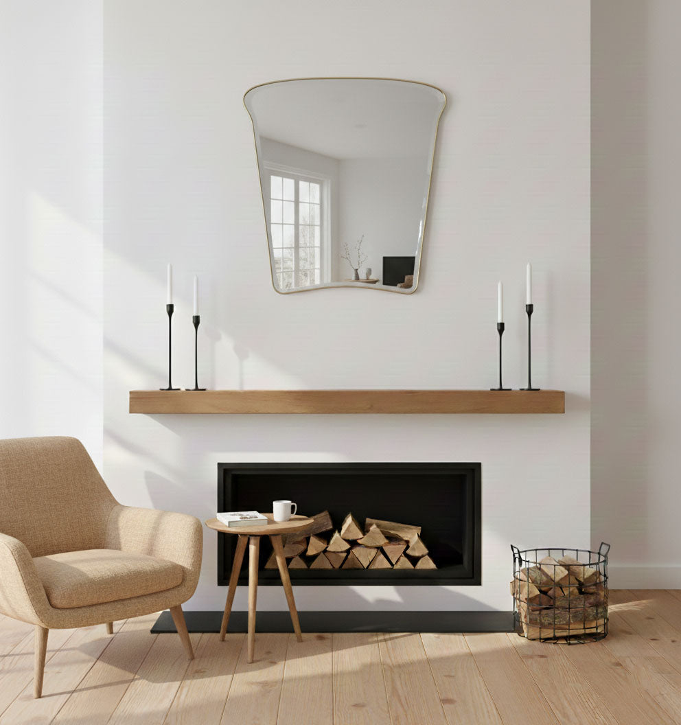 Tulip Crest brass wall mirror styled above fireplace in modern living room
