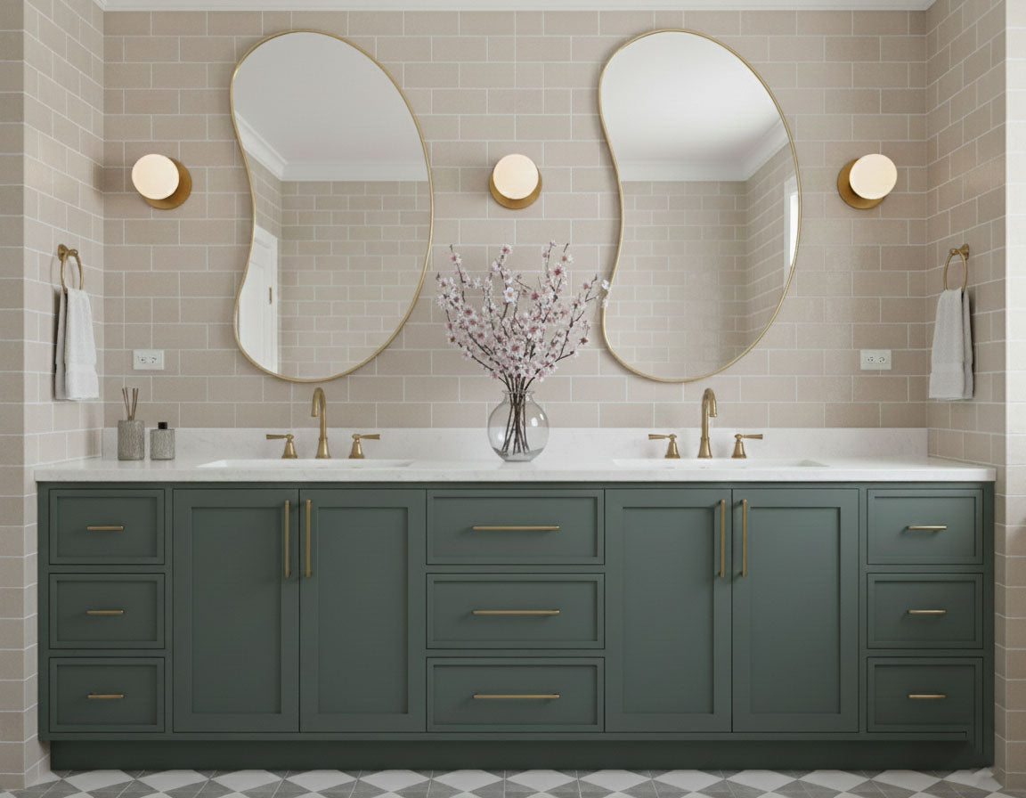 Pair of bean curve brass mirrors over double bathroom vanity