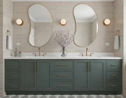 Pair of bean curve brass mirrors over double bathroom vanity