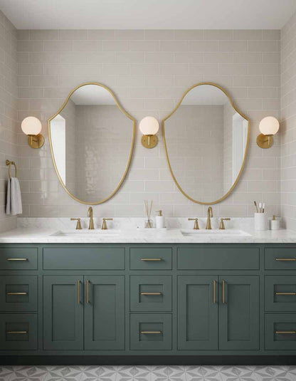Pair of Italian shield brass mirrors over double vanity