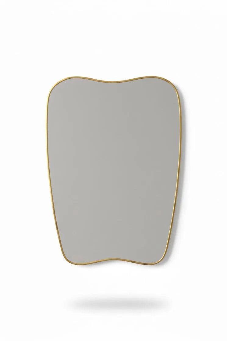 Handmade soft-crest brass mirror on white background