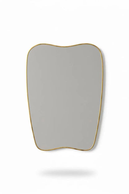 Handmade soft-crest brass mirror on white background