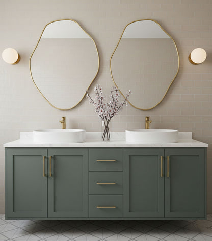 Pair of freeform brass mirrors above double sink vanity in contemporary bathroom