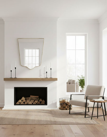 Minimal crest-edge mirror displayed above fireplace in modern living room