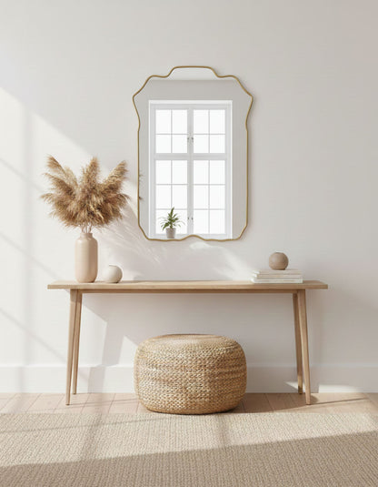 Soft crest rectangle brass mirror in minimalist entryway interior