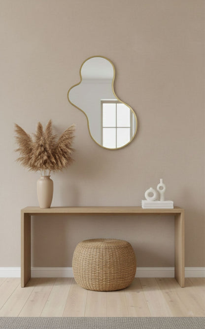 Amoeba brass mirror styled in a neutral modern living space