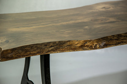 Close-up of a wooden table with a natural finish on a plain background
